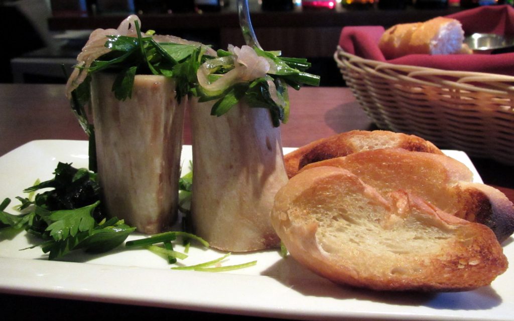 Roasted Maui Cattle Co Bone Marrow, Pickled Shallots, Fine Herbs, Meyer Lemon Zest and Toasted Crostini